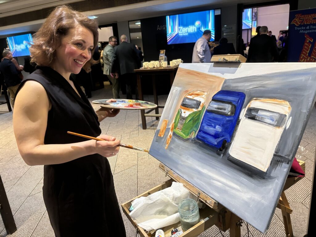 Cheryl Morrice painting at an event