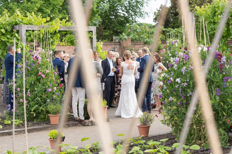 Wedding guests gathered in the Walled Garden, Chewton Glen Hotel & Spa