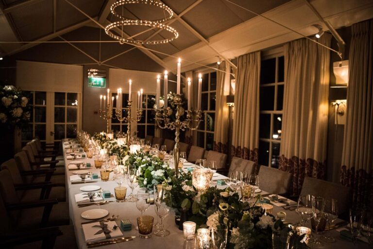 The Summer House dressed for a wedding breakfast, a long table under a fairy-lit canopy, Chewton Glen Hotel & Spa