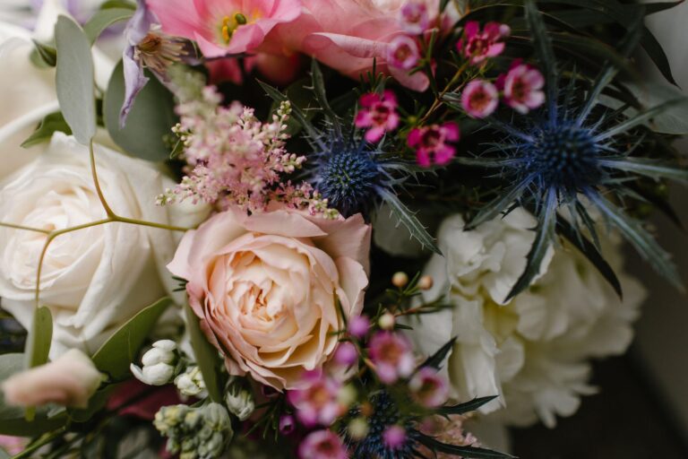 A bridal bouquet of roses, astilbe, sea holly and wax flower, Cluny Castle