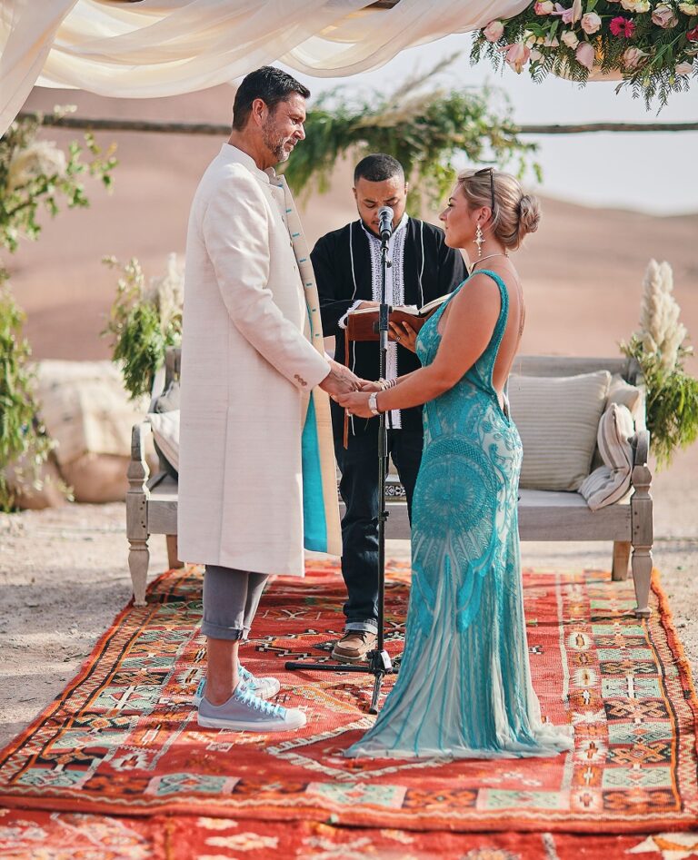 Couple exchanging vows on a patterned rug, Cocoon Events