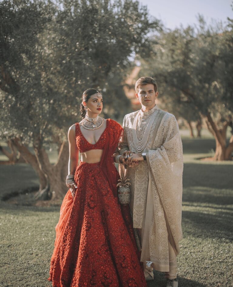 Couple in traditional dress in an olive grove, Cocoon Events