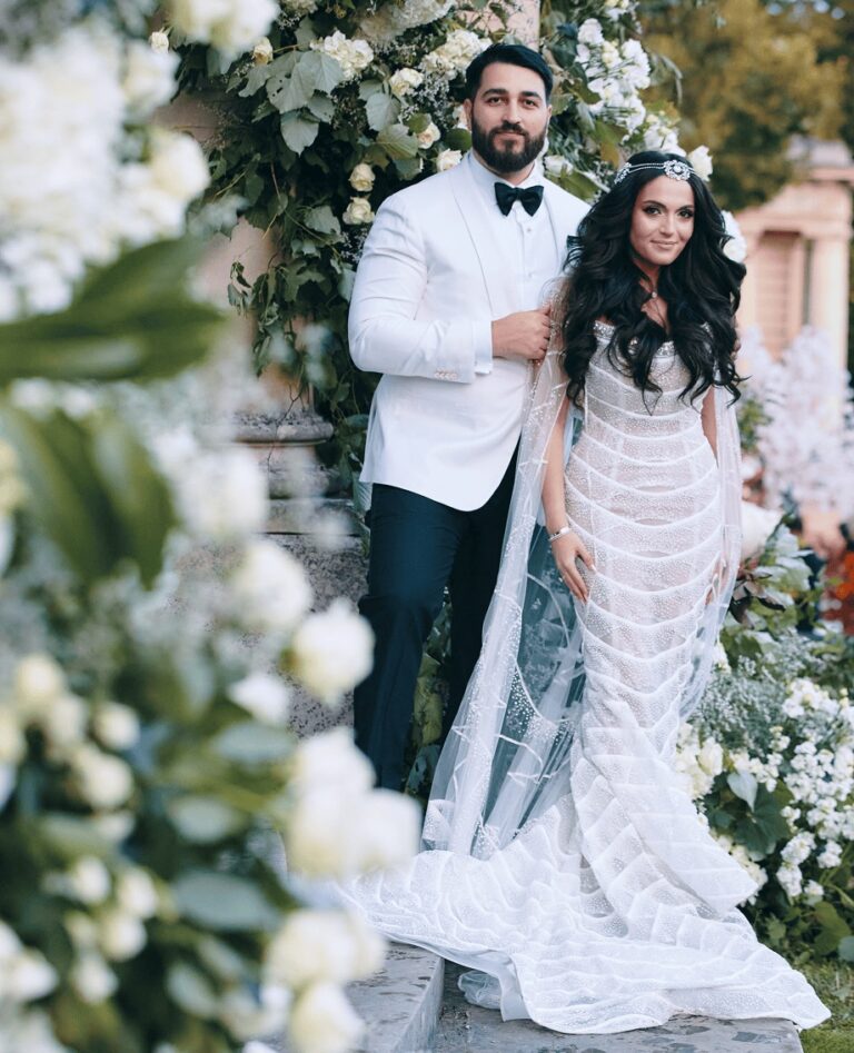 Couple in white among floral arrangements, Cocoon Events