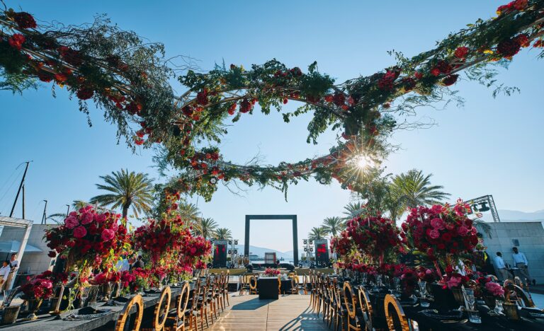 Floral gateway above a reception terrace by the water, Cocoon Events