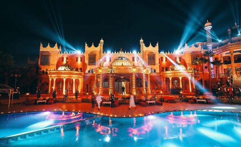Illuminated palace facade reflected in a pool, Cocoon Events