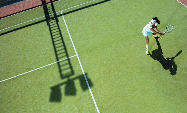 Playing tennis on the grass court, Columbia Beach Resort