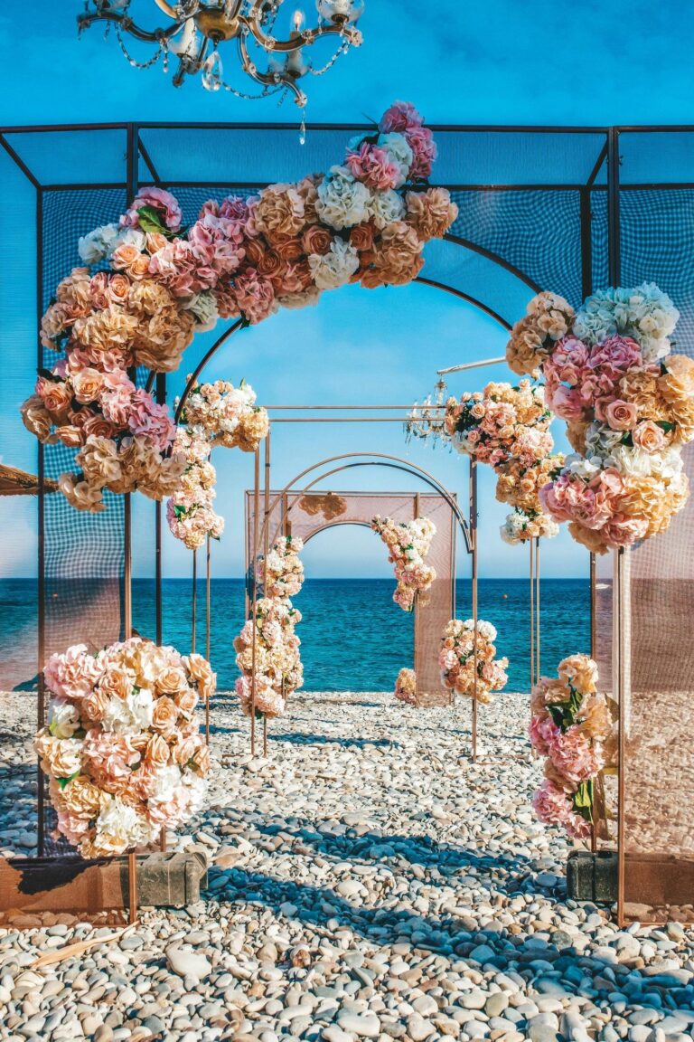 Floral arch set on the beach for a ceremony, Columbia Beach Resort