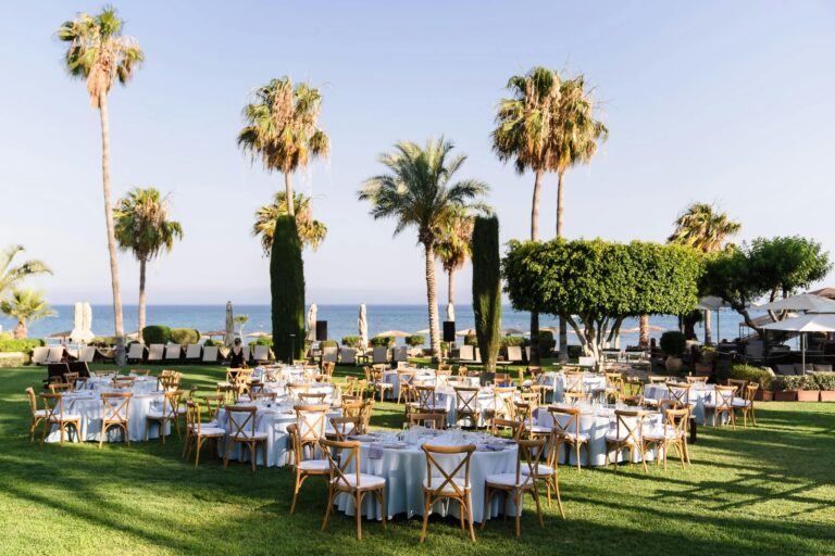 Round tables set for a reception on the lawn, Columbia Beach Resort
