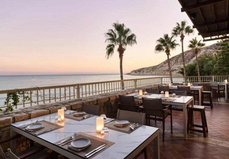 Candlelit tables at Cape Aspro above the bay, Columbia Beach Resort