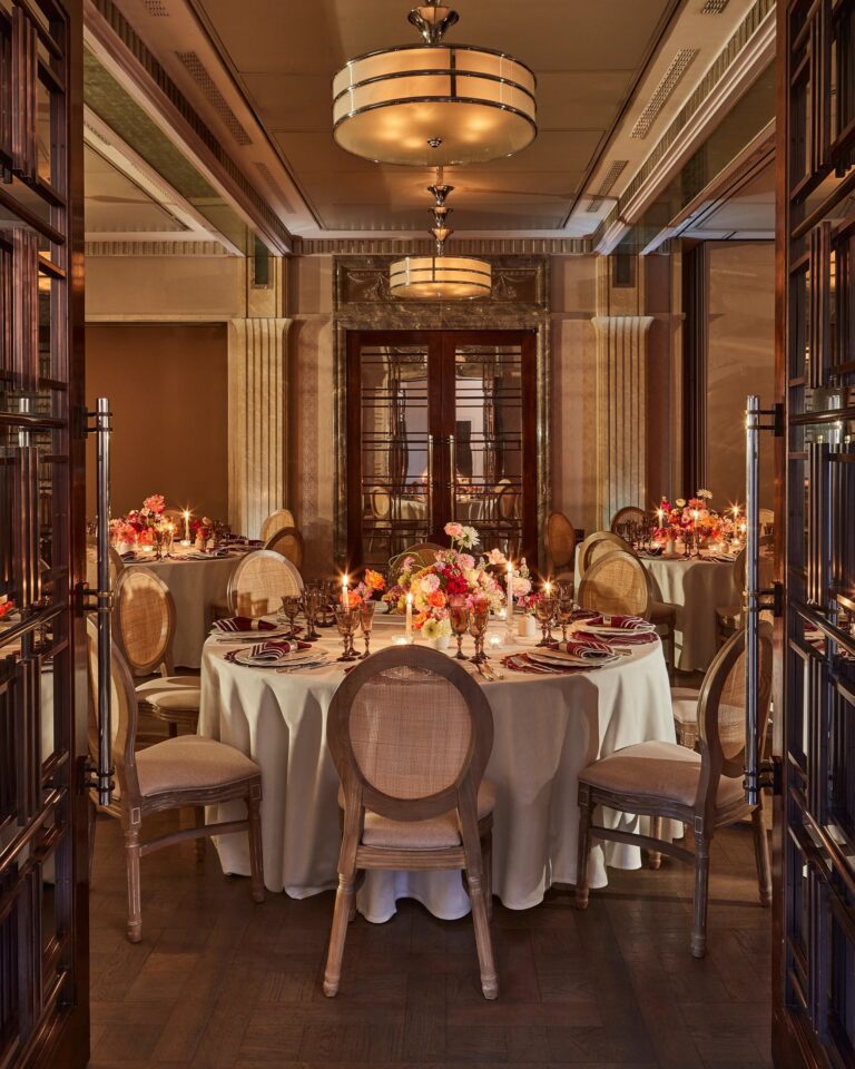 Round table dinner seen through the Mayfair Room doors, The Connaught