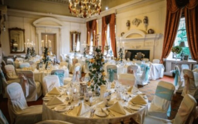 Round tables laid for a wedding breakfast, Coombe Abbey
