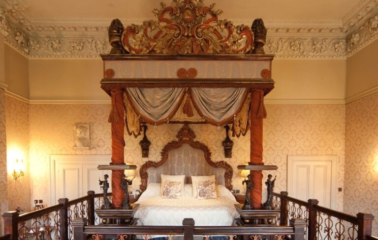 A bed with a carved canopy, Coombe Abbey