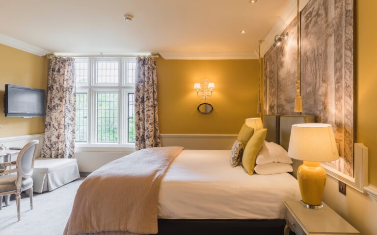 A bedroom with floral curtains, Coombe Abbey