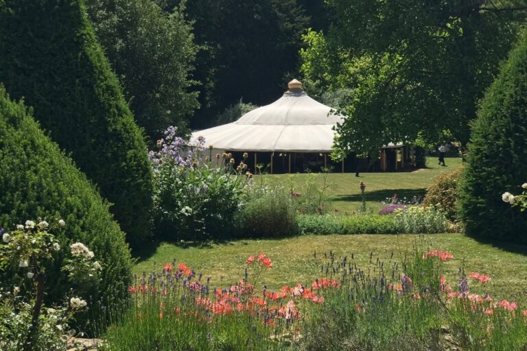 A marquee in a clearing in the gardens, Cornwell Manor