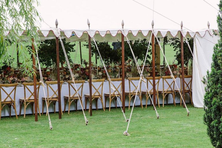 A long table beneath a frame marquee on the lawn, Cornwell Manor