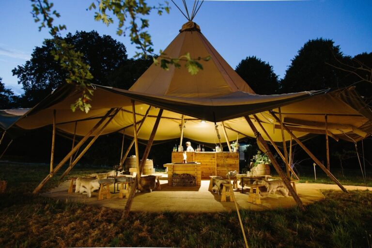 A tipi lit up at dusk, Cornwell Manor
