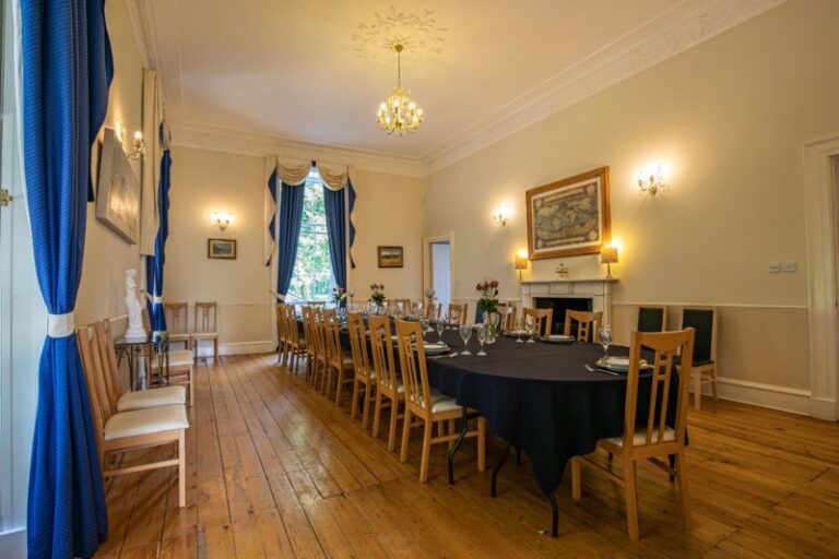 A reception room set for dining, Cortes House