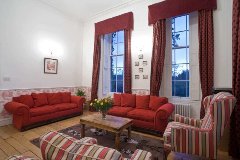A sitting room in red, for gathering, Cortes House