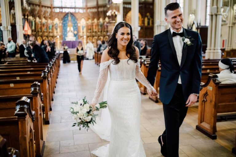 The newlyweds walking back down the church aisle, from the Hudson House wedding, Cottonwood Studios