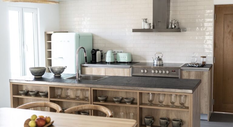 Kitchen with open shelving and dining table, Craveiral Farmhouse