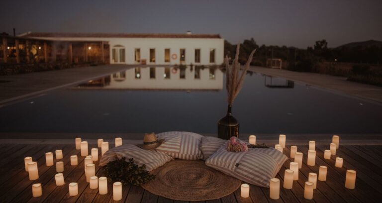 Candlelit pool-side setting at dusk, Craveiral Farmhouse