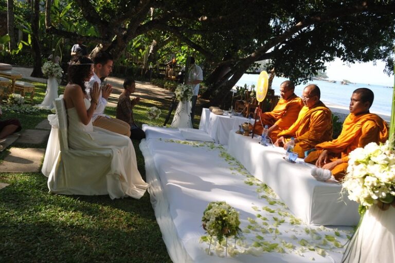 A Thai Buddhist blessing with monks seated beside the couple on a resort lawn, Creative Events Asia