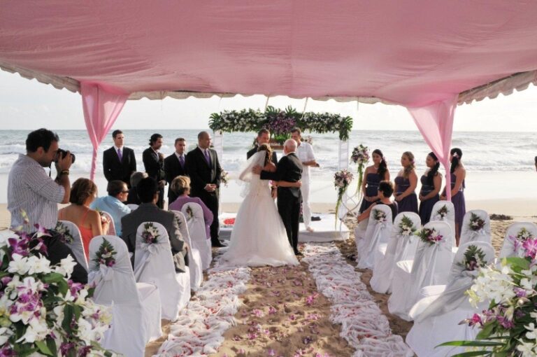 A ceremony beneath a pink canopy with a petal-lined aisle, Creative Events Asia
