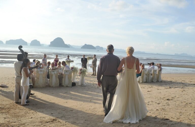 A bride walking along the beach to her ceremony, Creative Events Asia