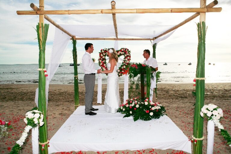 A couple at a bamboo pavilion with a heart-shaped floral arch, Creative Events Asia