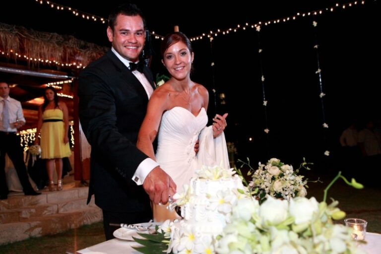 A couple cutting their cake at an evening reception, Creative Events Asia