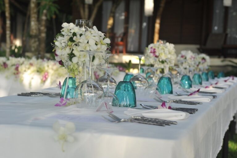 A banquet table with white orchids and teal glassware, Creative Events Asia
