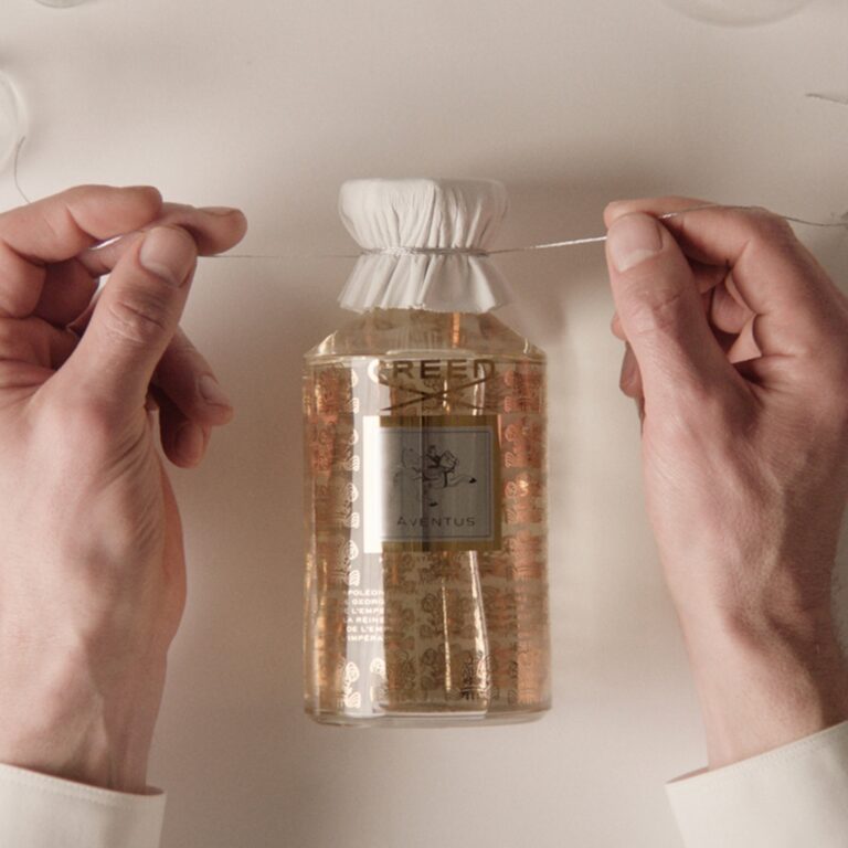 A bottle dressed by hand in the Creed workshop, Creed