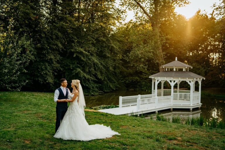 The couple on the lawn beside the Lake Pavilion in low sun, Creeksea Place