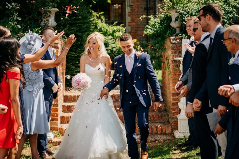 Confetti thrown over the couple on the brick garden steps, Creeksea Place