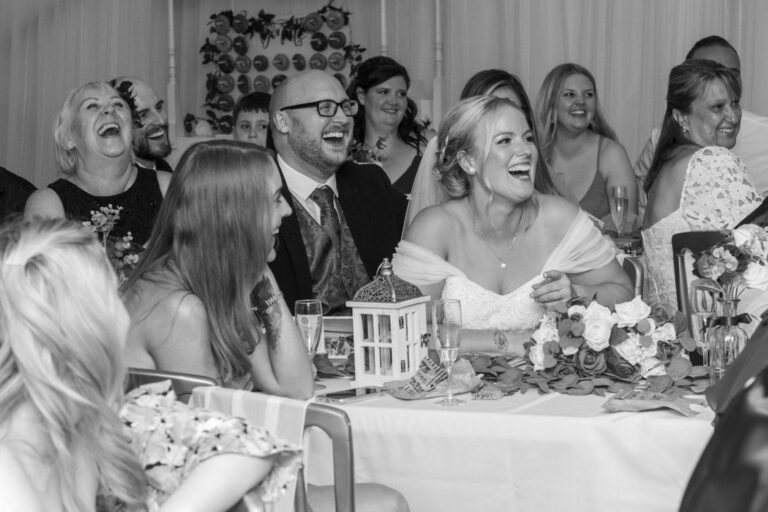 Black and white: the top table, laughter during the speeches, Creeksea Place