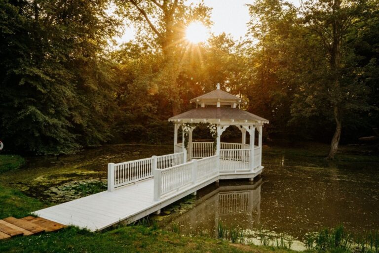 The Lake Pavilion and its white timber bridge at sunrise, Creeksea Place