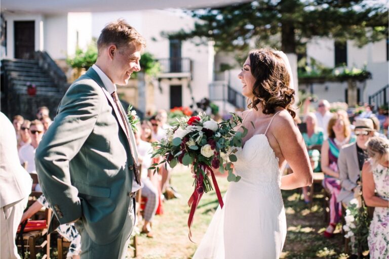 A groom and bride with guests at a winery ceremony, Crete for Love