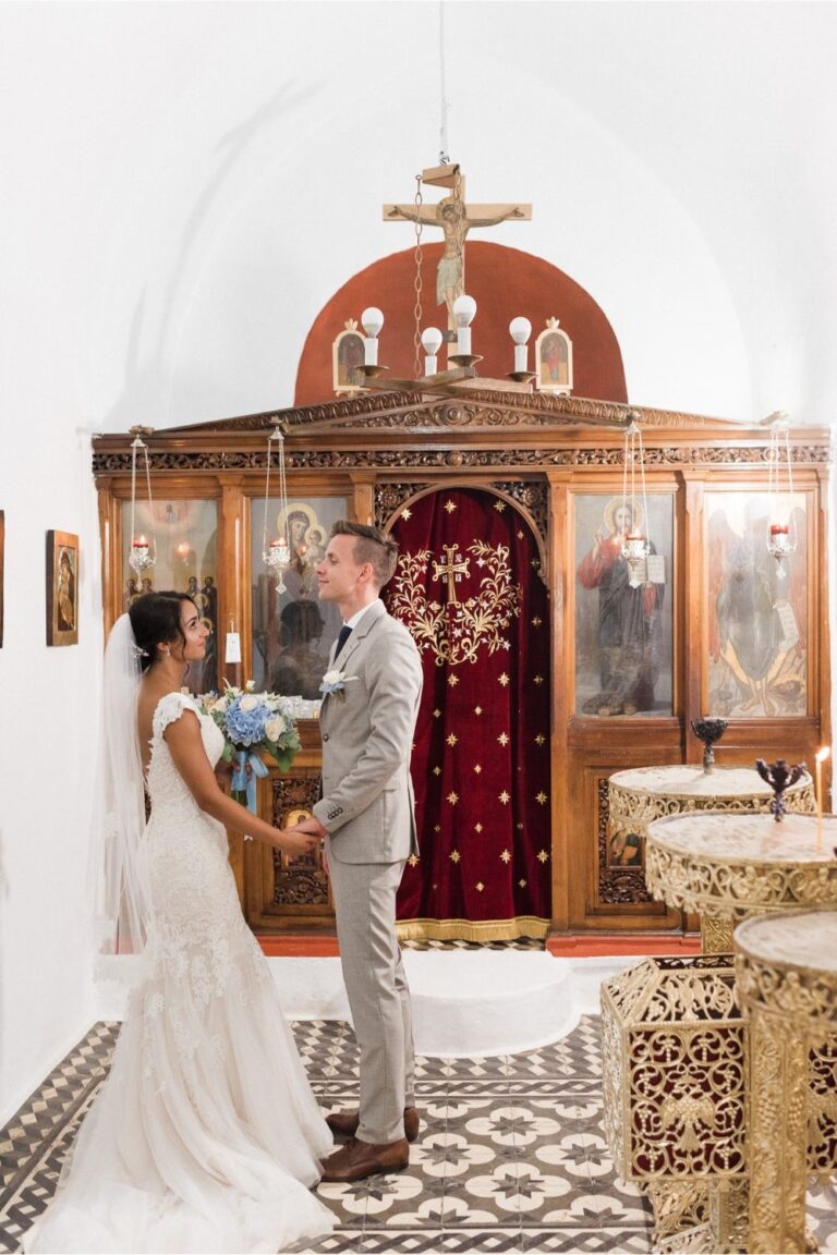 A couple exchange vows in front of a Greek Orthodox iconostasis, Crete for Love