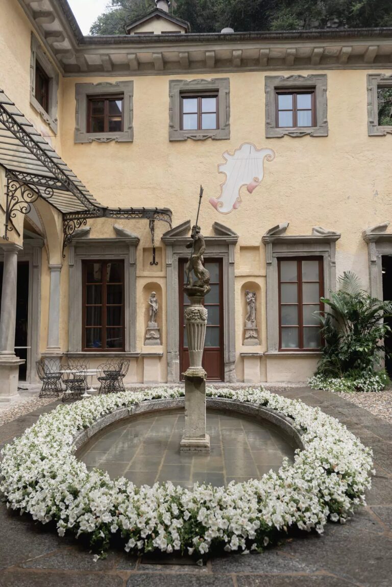 A villa courtyard fountain ringed with white flowers, Lake Como, Cristina Verger Event Planning and Production
