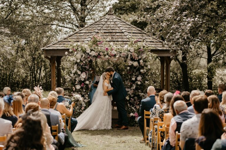 A ceremony at the Orchard Pavilion, seen from behind the guests, Crockwell Farm