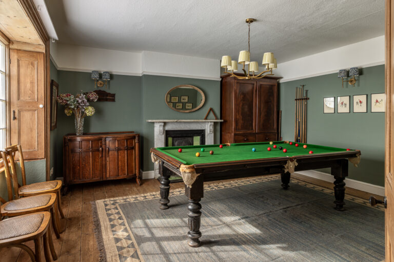 The Farmhouse snooker room, with a full-size table and a marble fireplace, Crockwell Farm