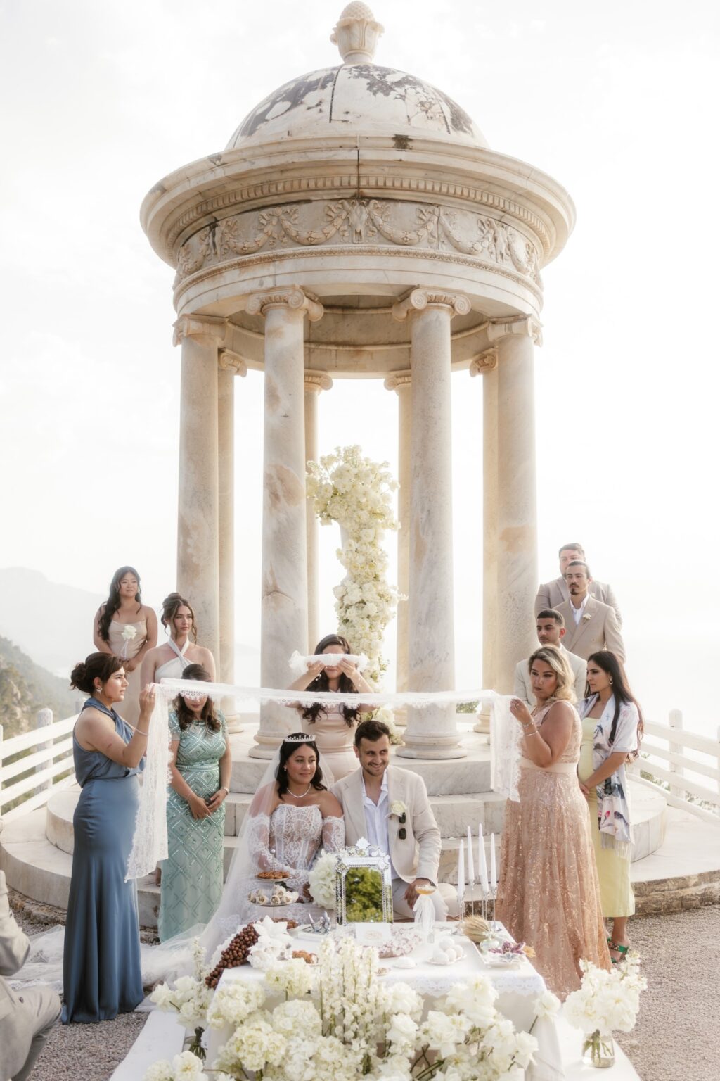 Guests gathered around the marble pavilion for a ceremony at Son Marroig, Mallorca, Cygnus Events