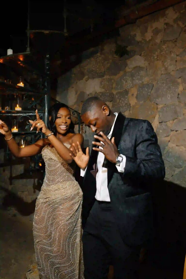 A couple dancing at the reception against a stone wall, Cygnus Events