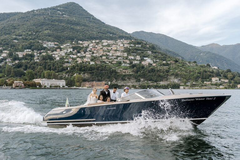 The couple and friends crossing Lake Como by wooden motorboat, Daniele Vertelli Photography