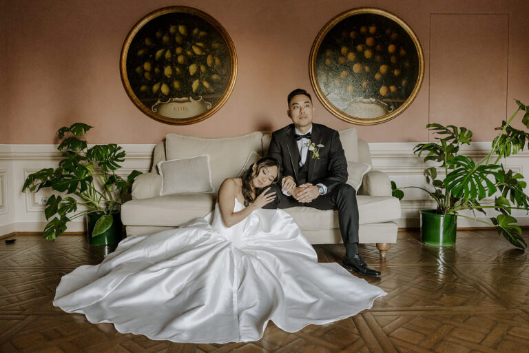 A couple resting on a sofa beneath two antique platters, hills of Florence, Daniele Vertelli Photography