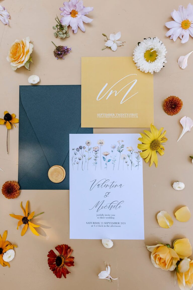 Wedding stationery laid out among loose summer flowers, Convento dell'Annunciata, Daniele Vertelli Photography