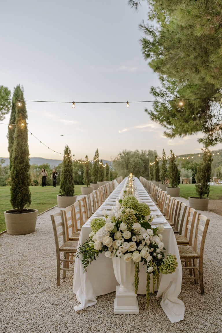A long table set between cypresses at Conti di San Bonifacio, Maremma, Daniele Vertelli Photography