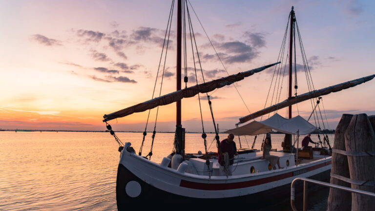 Bragozzo sailing boat on the lagoon at sunset, Danieli, Venezia, A Four Seasons Hotel