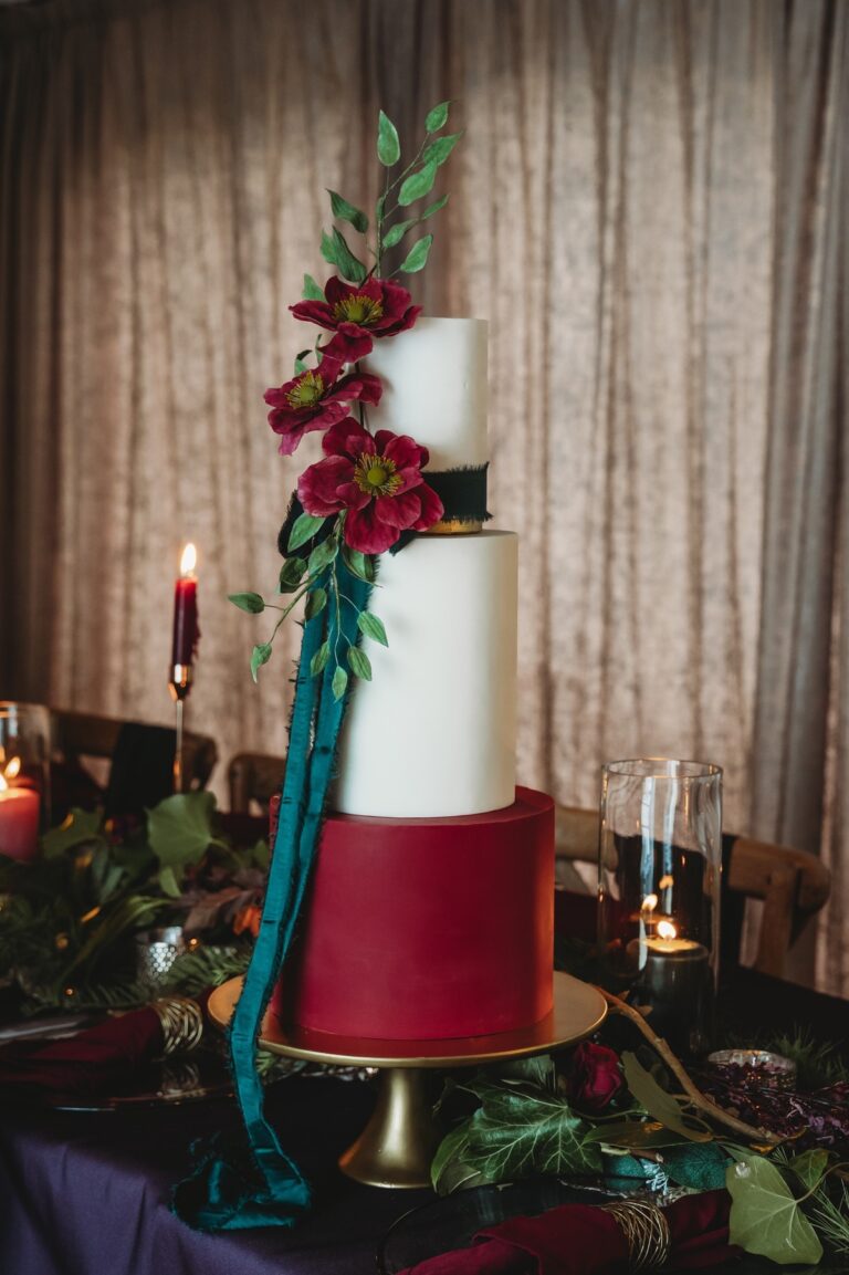 A cake in white and burgundy with green sugar leaves, Danielle's Cakes Pershore