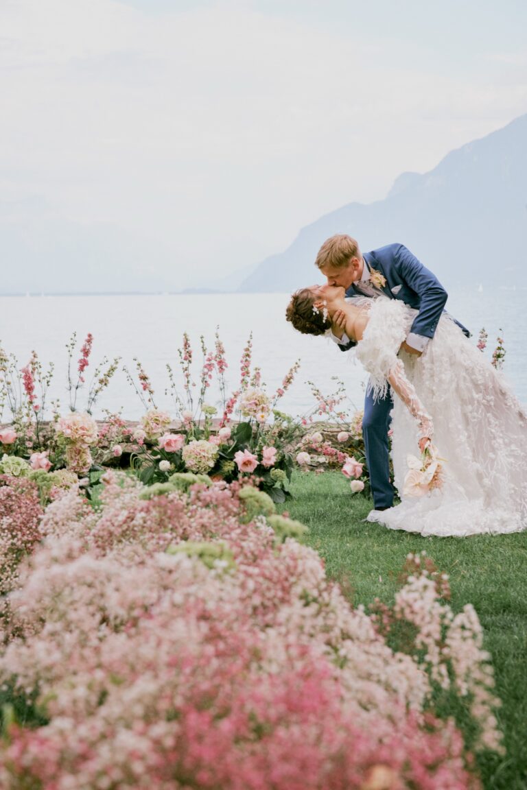 Couple kissing in a flower meadow above Lake Geneva, Château de Glerolles, Lavaux, Switzerland, Daria Events and Weddings